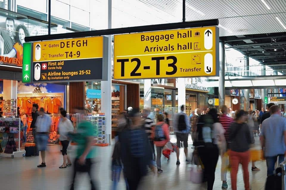 Airport inside people shops currency exchange counters