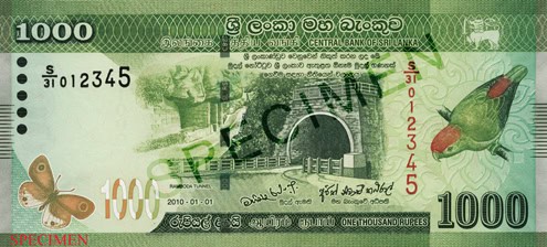 On the front centre of the LKR 1000 note, a drawing of the Ramboda tunnel can be seen. To the left of it is the rock wall. The bird that appears to the right of the note is the Sri Lankan Hanging Parrot while the butterfly on the left is the White Four Ring.
