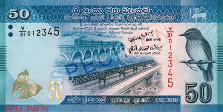 The bridge in Manampitiya appears in the centre of the LKR 50 note. The formerly used bridge appears to the left of the new bridge. Above both, is the historical railway arch bridge. The bird on the right side of the note is the Sri Lankan Dull Blue Flycatcher. The butterfly on the left is the Blue Oakleaf.