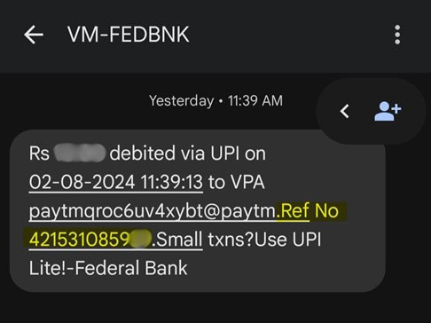 An SMS notification from VM-FEDBNK showing a debit transaction via UPI on 02-08-2024 at 11:39:13 to the VPA paytmqroc6uv4xybt@paytm. The message includes a reference number and suggests using UPI Lite for small transactions.