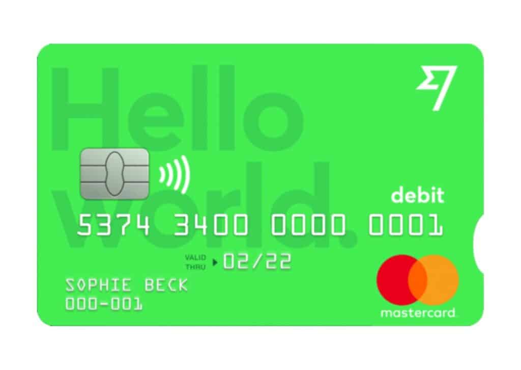Wise Borderless debit card with MasterCard branding, featuring a bright green design and the text 'Hello World' symbolizing global use.